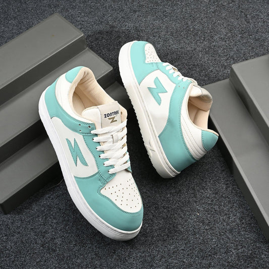 Pair of turquoise and white sneakers on a dark textured surface
