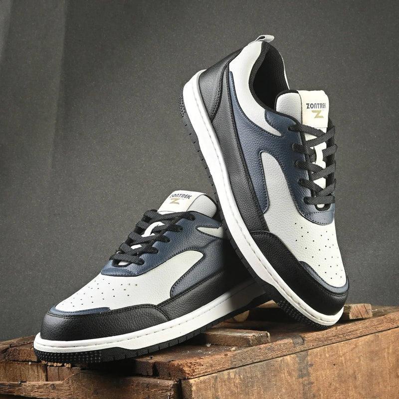 Close-up of a shoe with a colorful, abstract design on a dark background