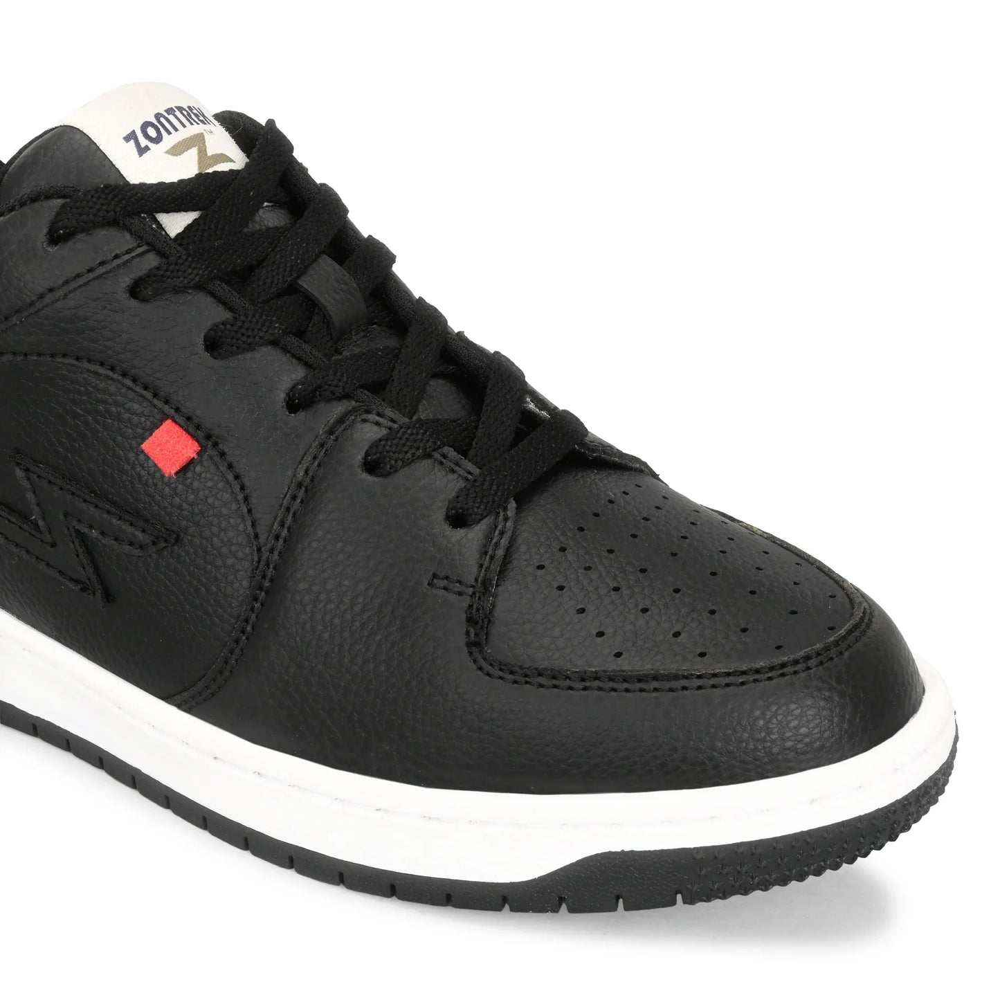 Black sneaker with a red label on a white background