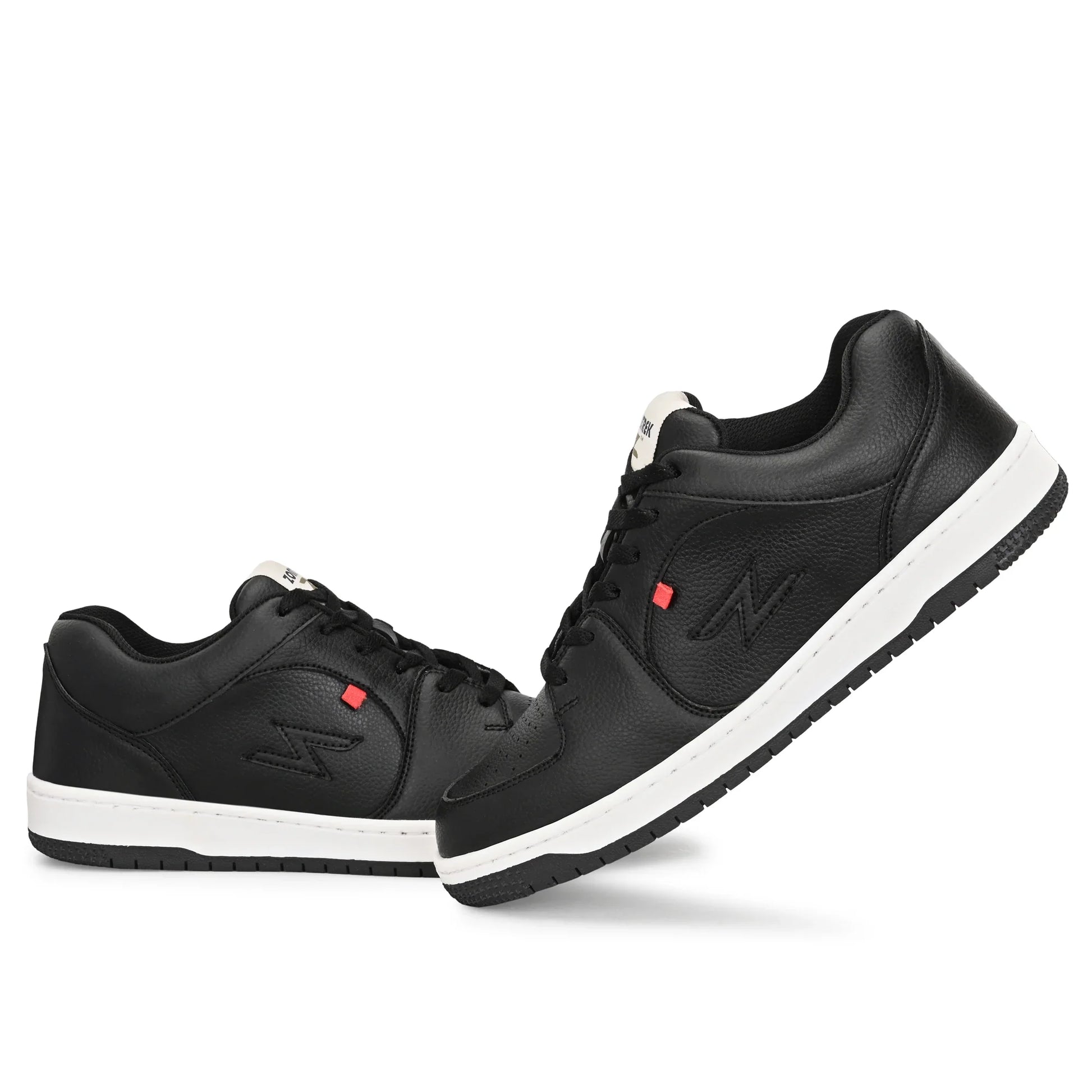 Black sneakers with white soles on a white background